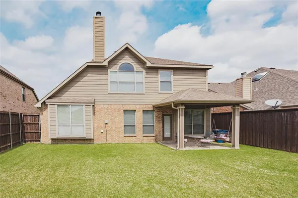 a view of a house with swimming pool and porch