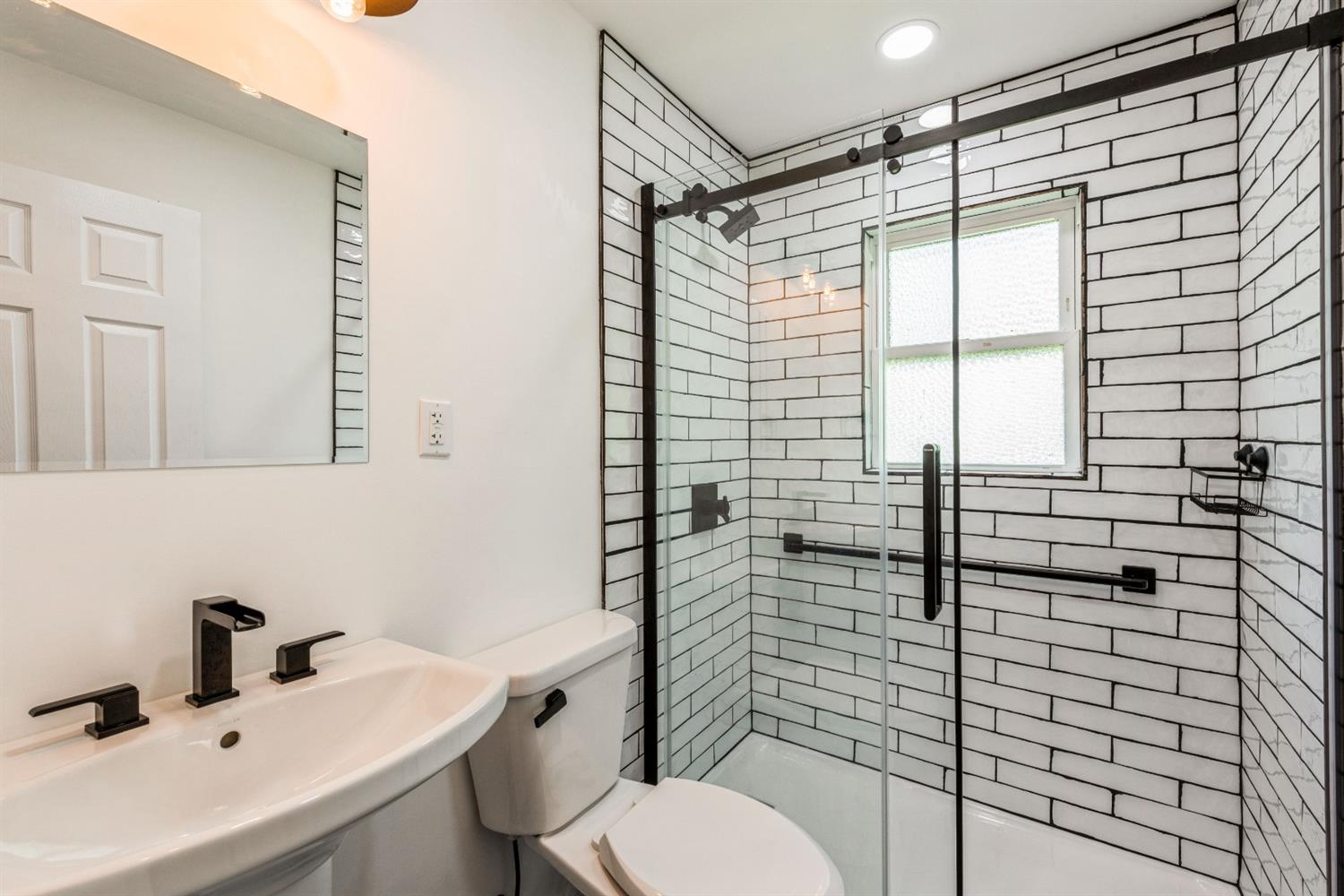 710 Heritage Road Valparaiso, IN 46385 - Photo 17 of 27 a bathroom with a sink toilet and shower