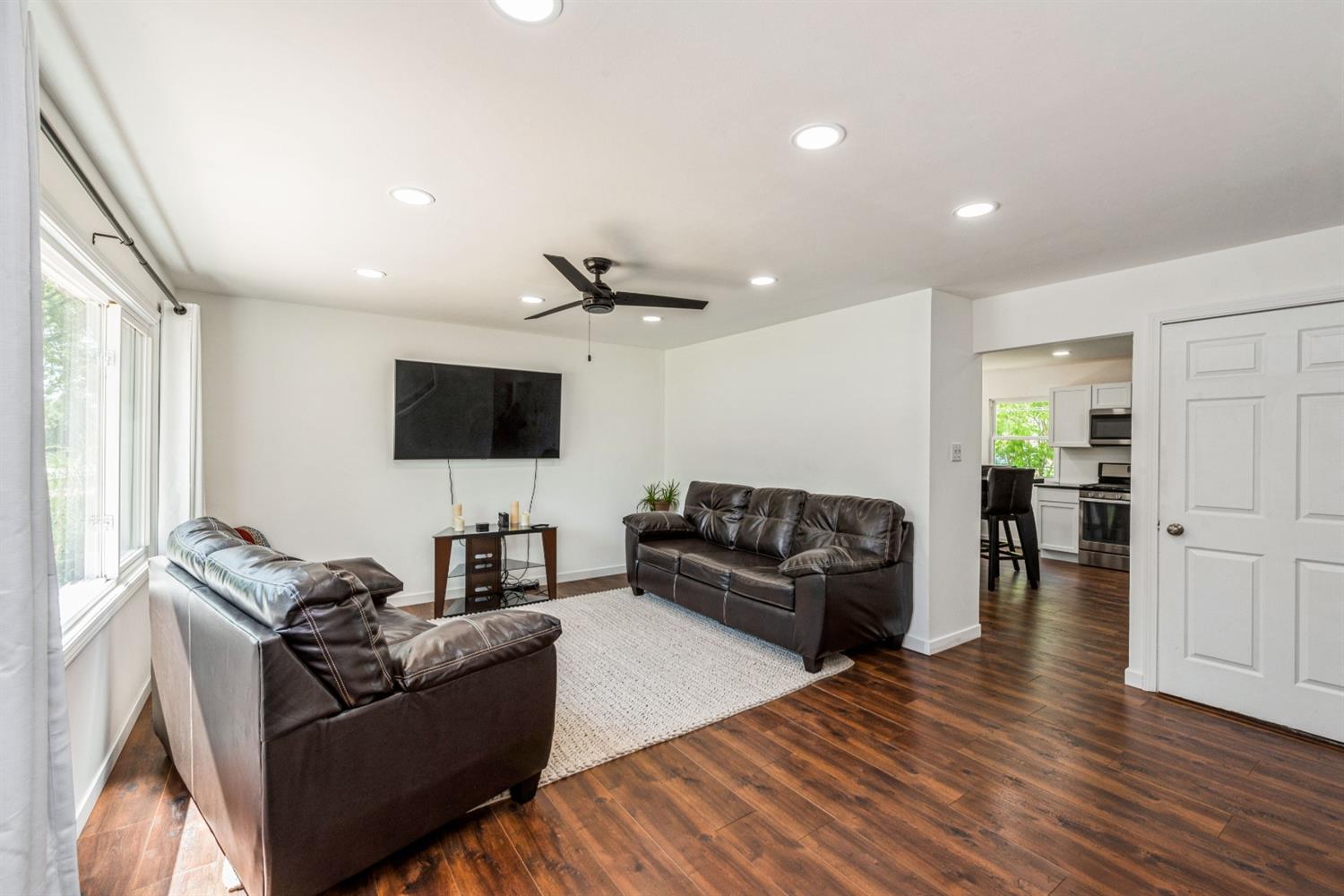 710 Heritage Road Valparaiso, IN 46385 - Photo 3 of 27 a living room with furniture and a flat screen tv