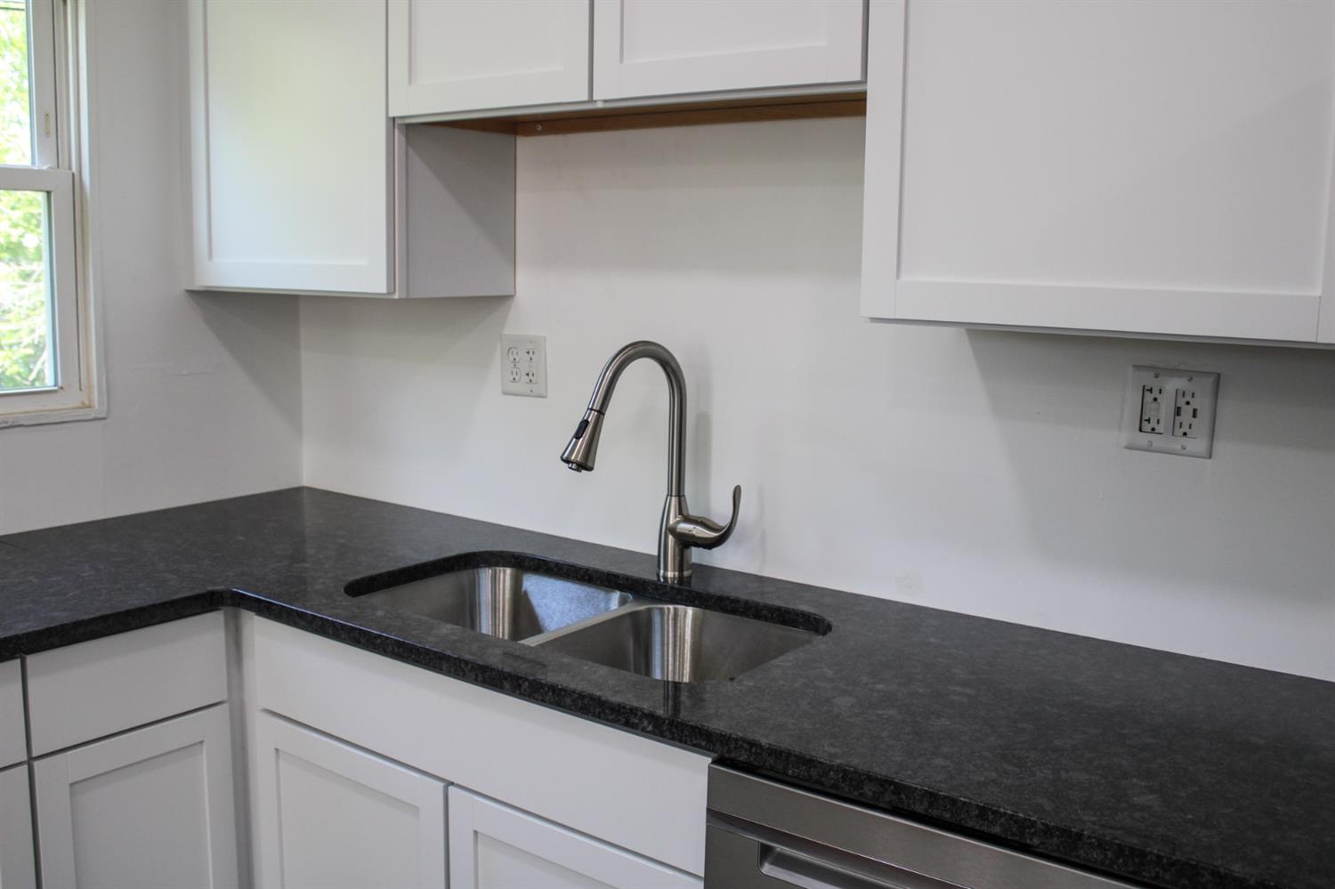 710 Heritage Road Valparaiso, IN 46385 - Photo 8 of 27 a kitchen with a sink and cabinets