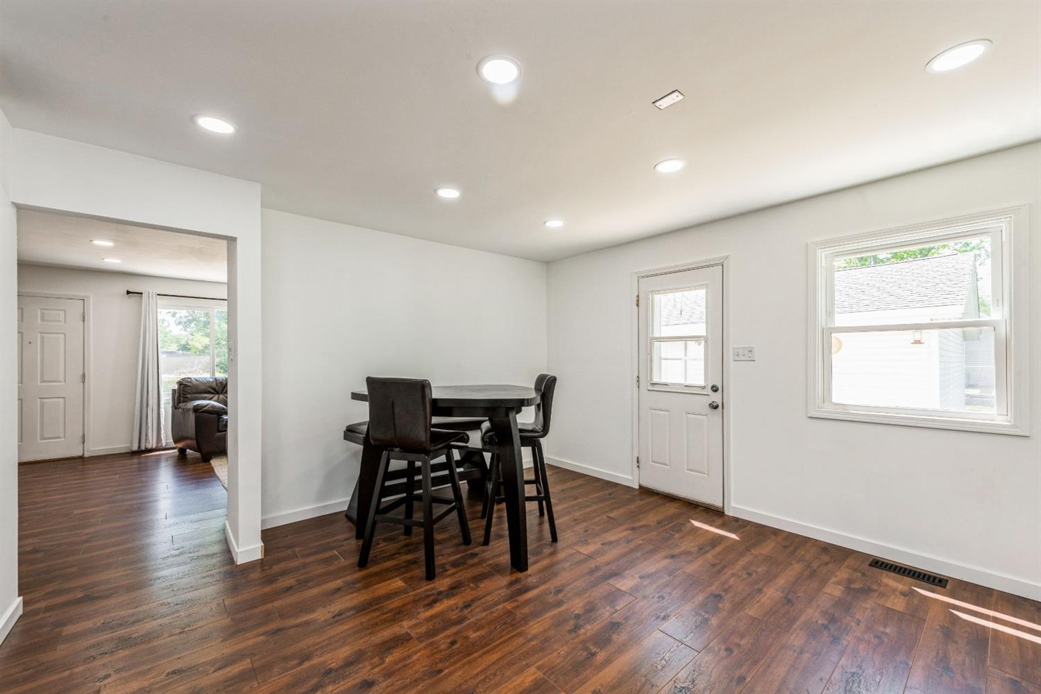 710 Heritage Road Valparaiso, IN 46385 - Photo 10 of 27 a view of a dining room with furniture and wooden floor