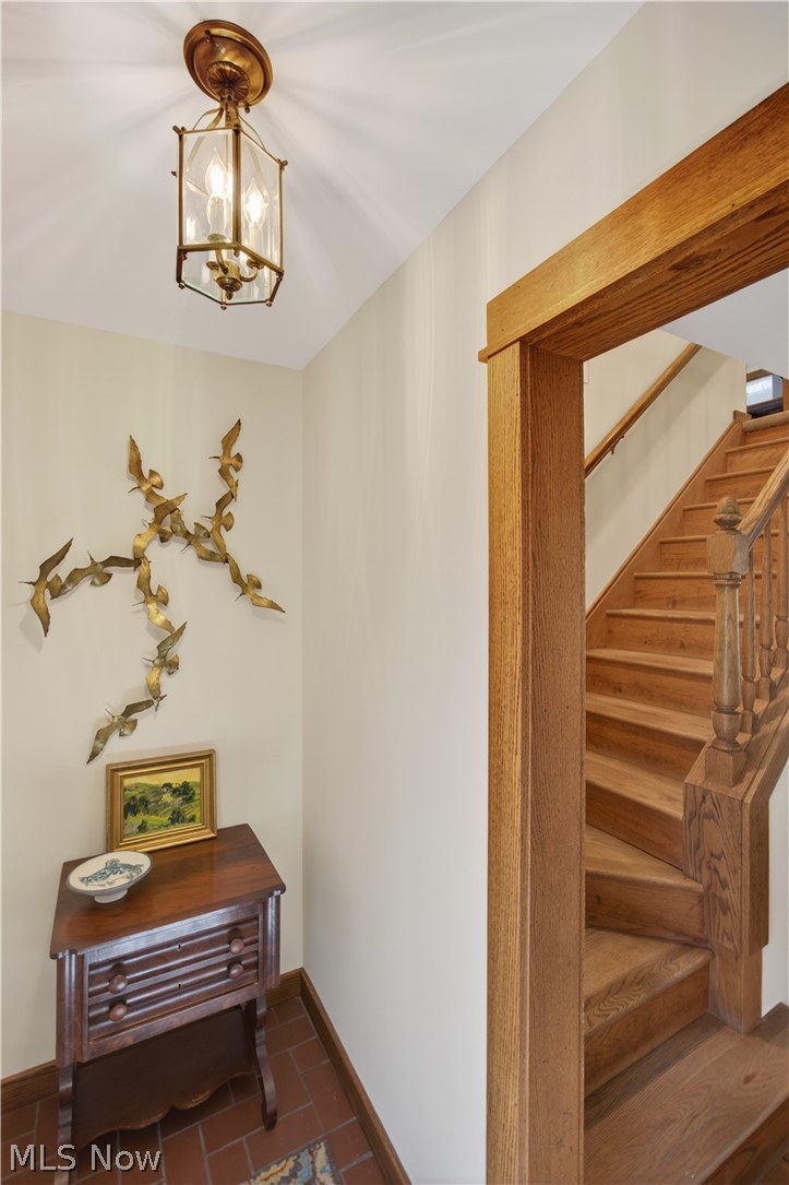 31599 Fairview Road Chagrin Falls, OH 44022 - Photo 22 of 50 A view from the vestibule towards the natural wood staircase that takes you upstairs