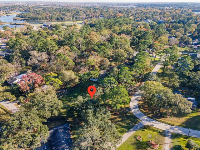 an aerial view of a houses with a yard