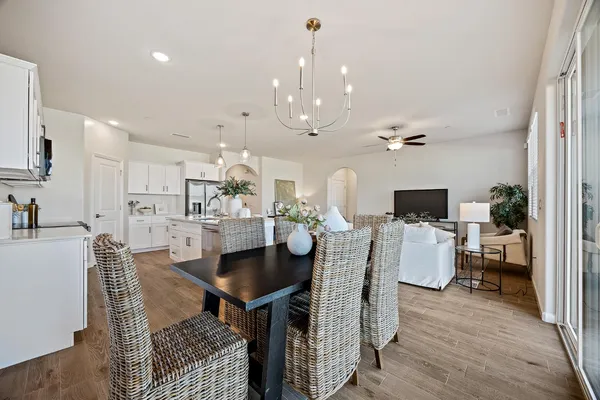 a view of a dining room with furniture and wooden floor