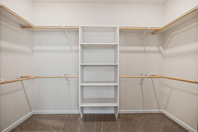 a view of an empty walk in closet