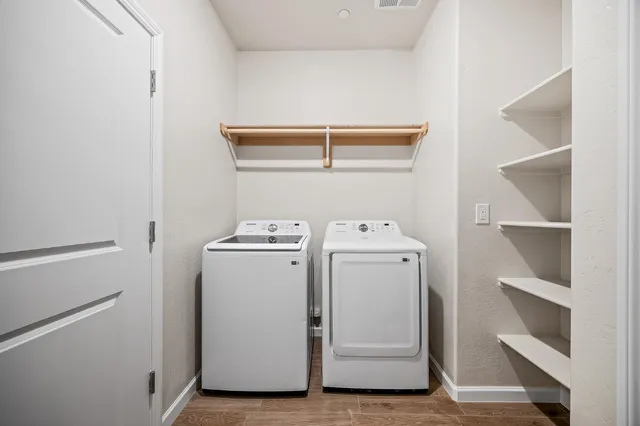 a utility room with dryer and washer