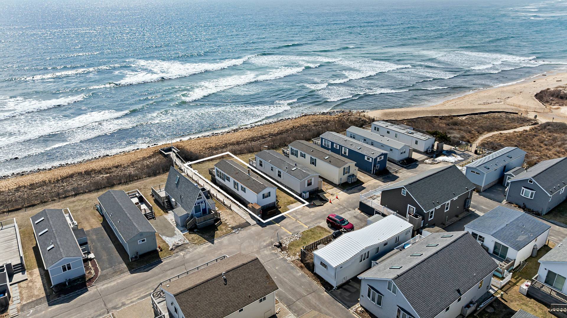 100 Deforest Road, Unit 6 Montauk, NY 11954 - Photo 1 of 6 an aerial view of a house with a ocean