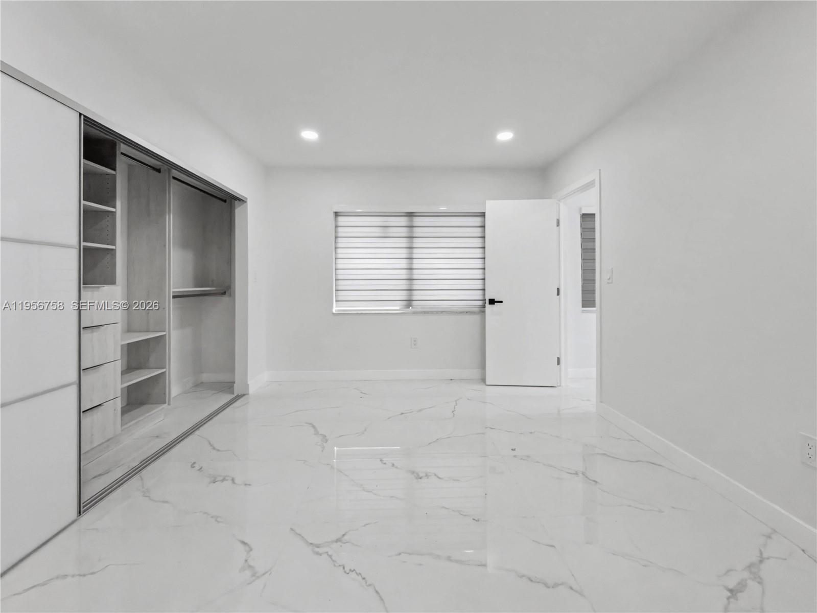 2490 Southwest 17th Street Miami, FL 33145 - Photo 12 of 36 a view of an empty room with a window