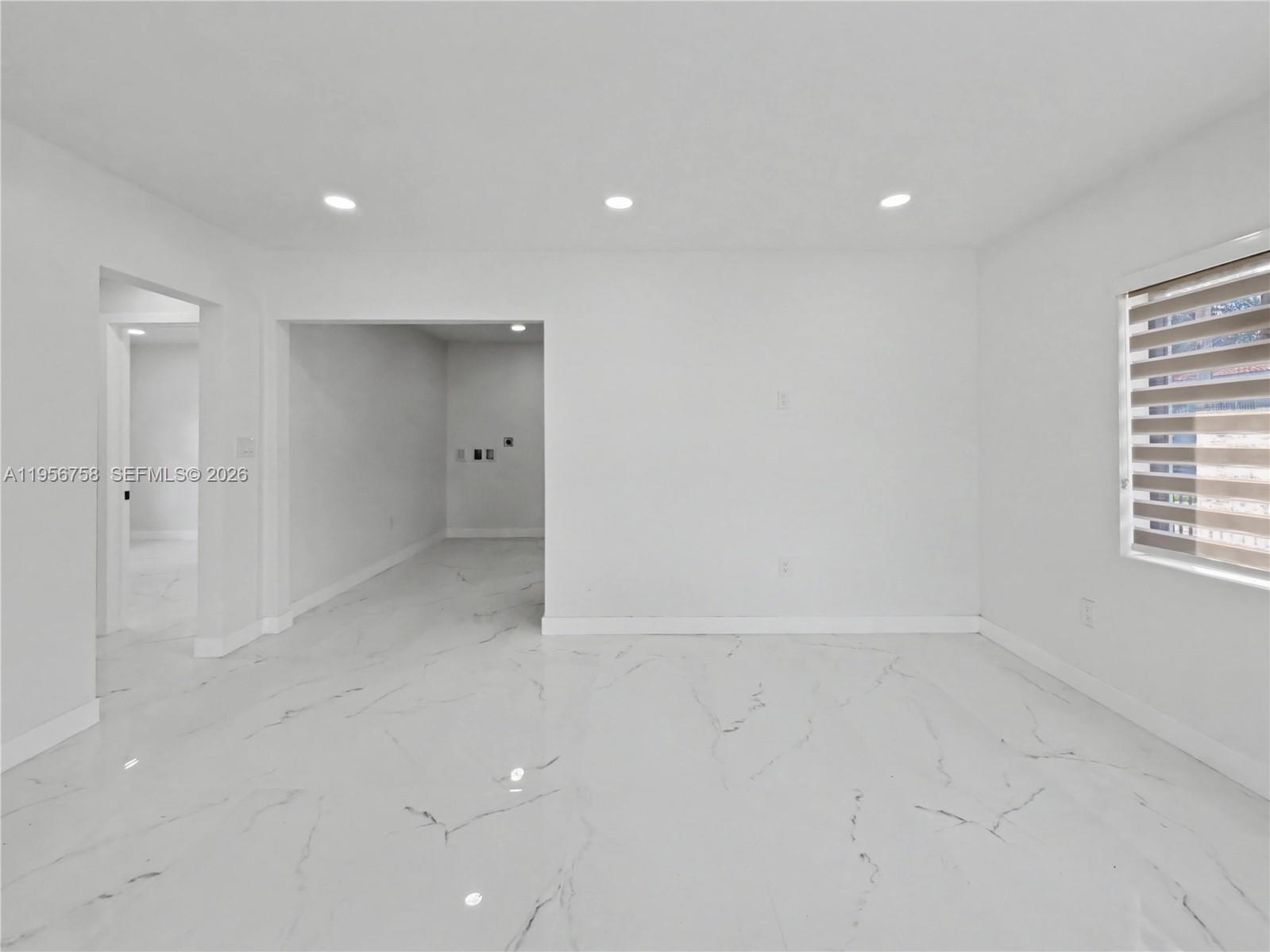 2490 Southwest 17th Street Miami, FL 33145 - Photo 19 of 36 an empty room with a empty space and windows