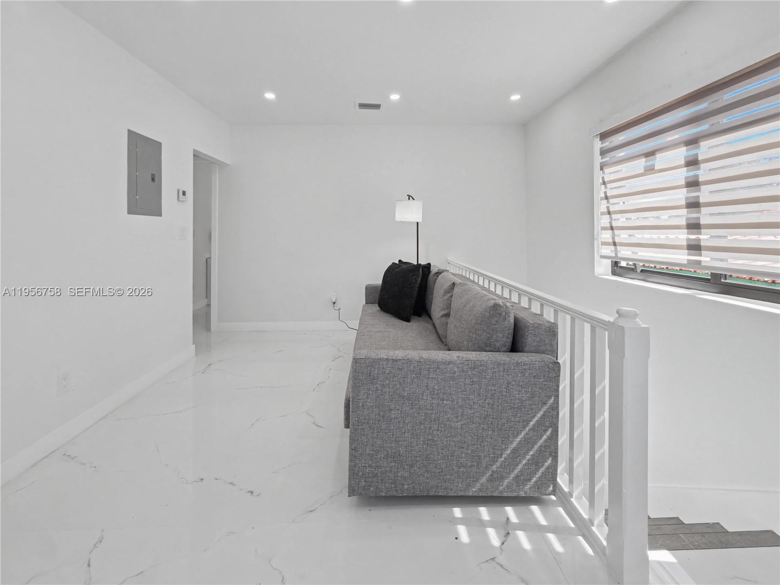 2490 Southwest 17th Street Miami, FL 33145 - Photo 31 of 36 a living room with furniture and a window