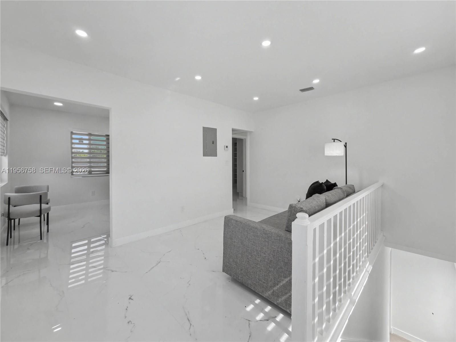 2490 Southwest 17th Street Miami, FL 33145 - Photo 32 of 36 a living room with furniture and a window