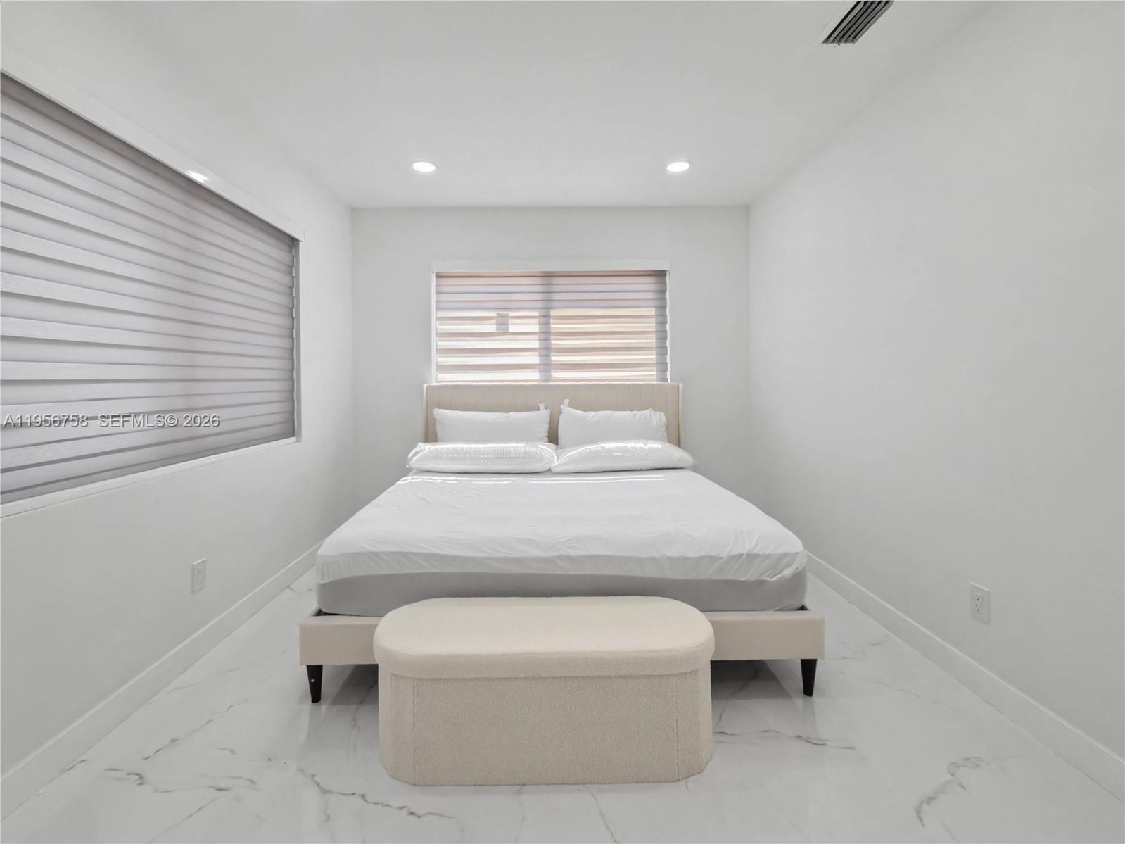 2490 Southwest 17th Street Miami, FL 33145 - Photo 34 of 36 a bedroom with a bed and a window