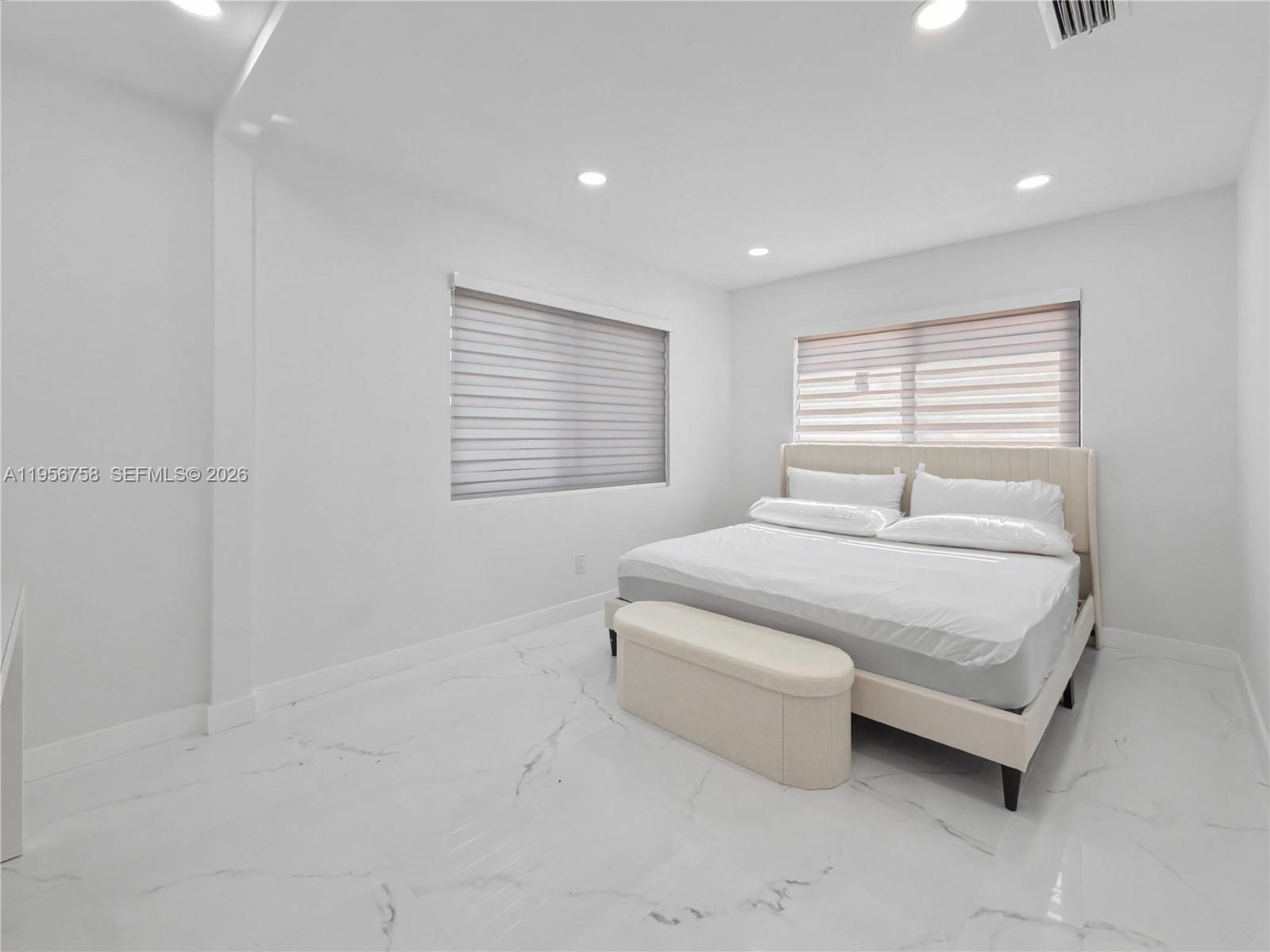 2490 Southwest 17th Street Miami, FL 33145 - Photo 35 of 36 a bedroom with a bed and a window