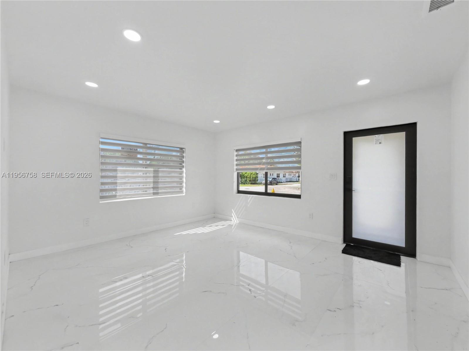 2490 Southwest 17th Street Miami, FL 33145 - Photo 8 of 36 an empty room with windows and closet