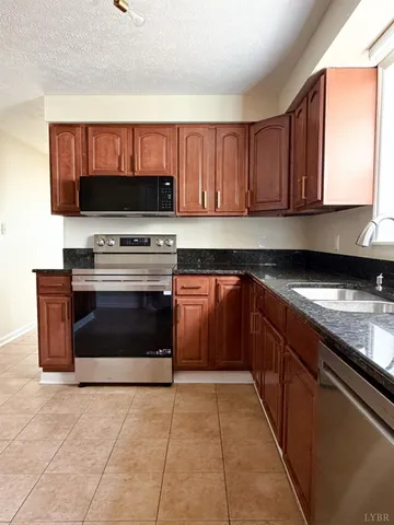 a kitchen with a cabinets and a stove top oven