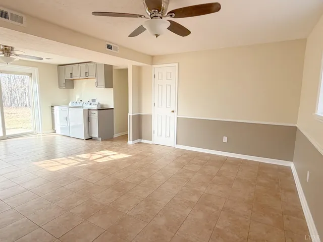 a view of a kitchen with a sink and a window