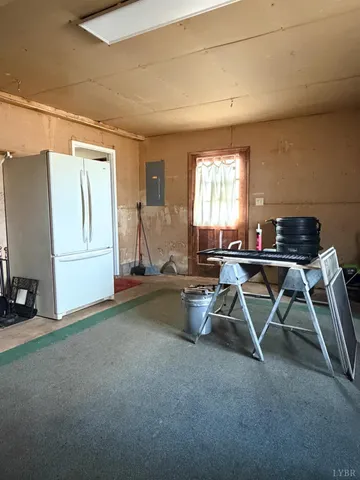 a work room with furniture and a window