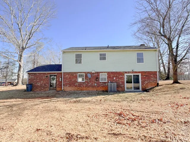 a view of a house with a snow in the yard