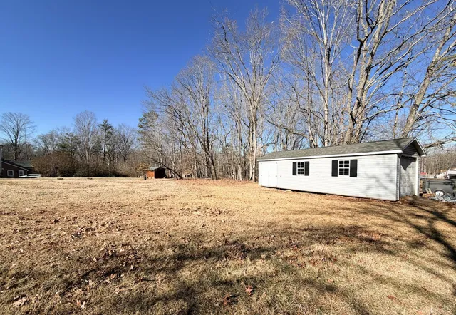 a view of a yard covered in snow