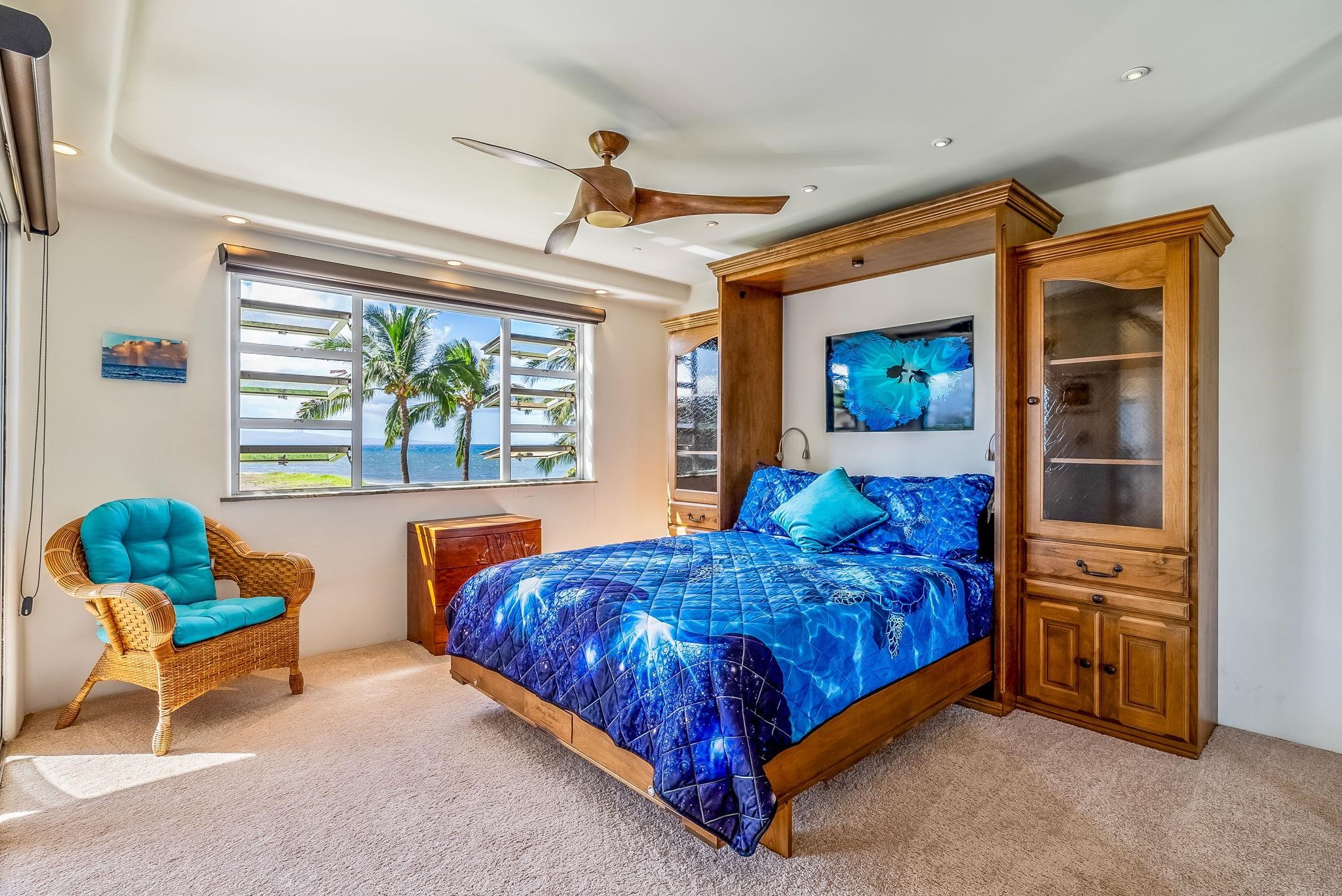 760 South Kihei Road, Unit 522 Kihei, HI 96753 - Photo 15 of 48 a bed room with a bed and a chair