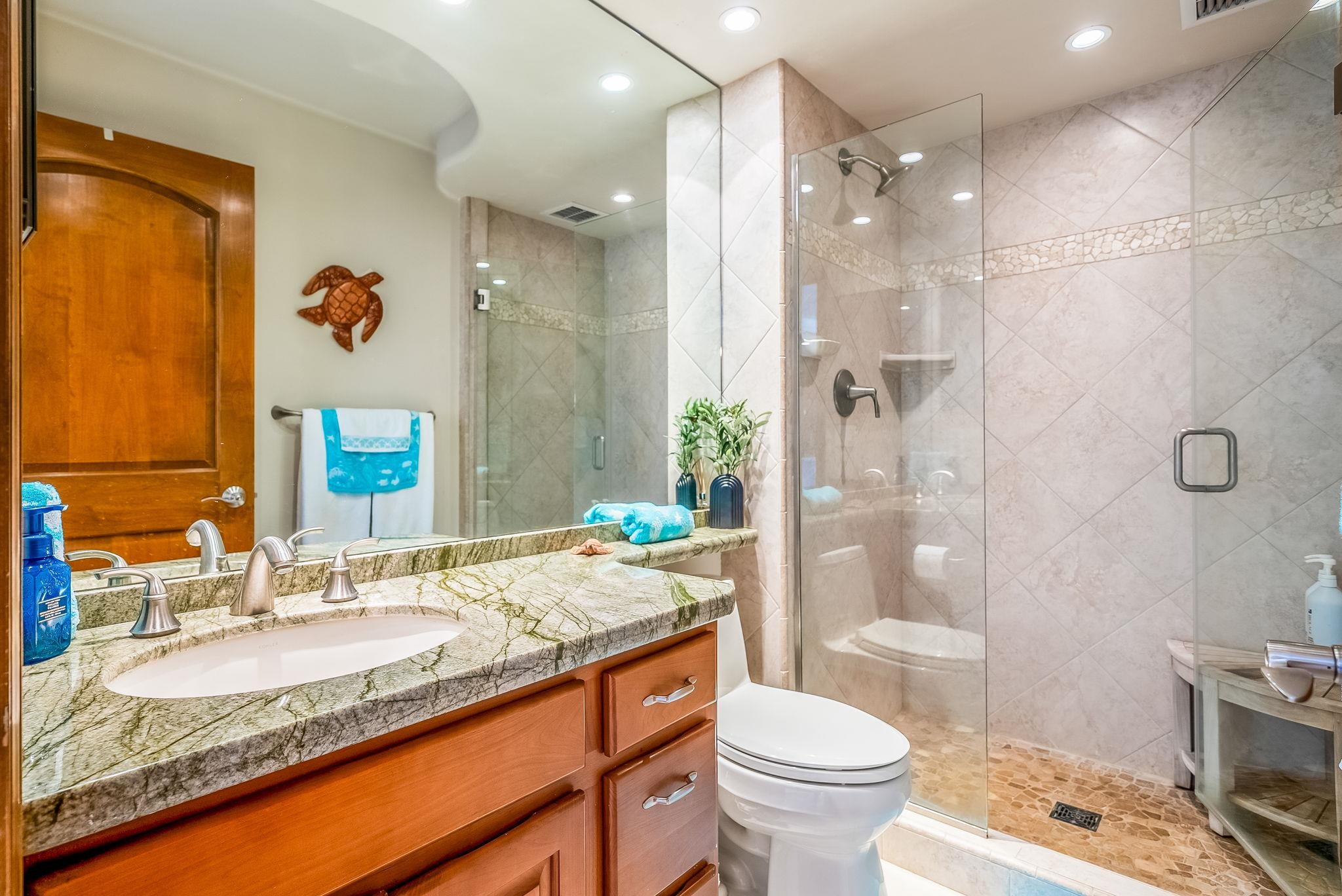 760 South Kihei Road, Unit 522 Kihei, HI 96753 - Photo 25 of 48 a bathroom with a granite countertop sink toilet and shower