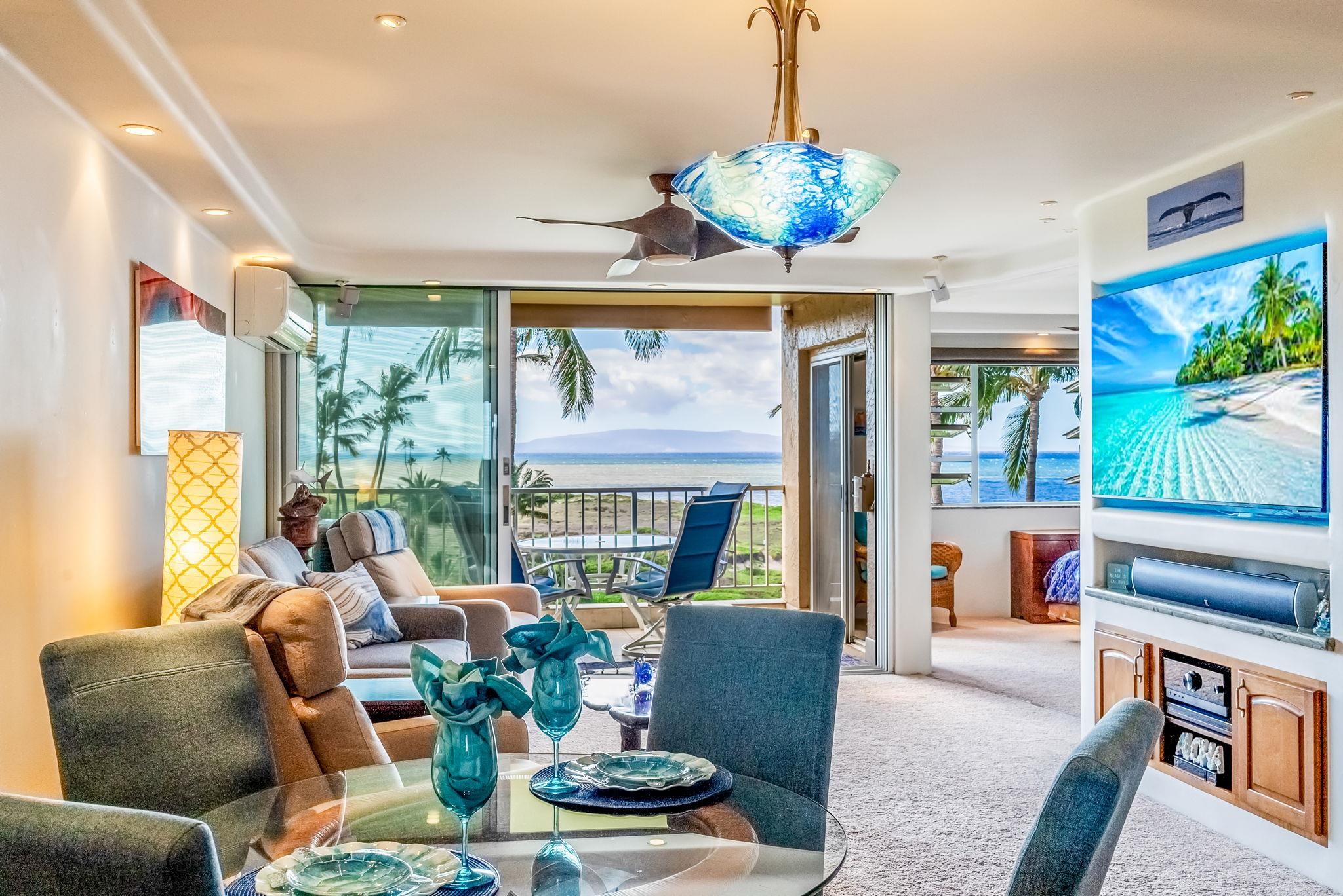 760 South Kihei Road, Unit 522 Kihei, HI 96753 - Photo 3 of 48 a living room with fireplace furniture and a large window