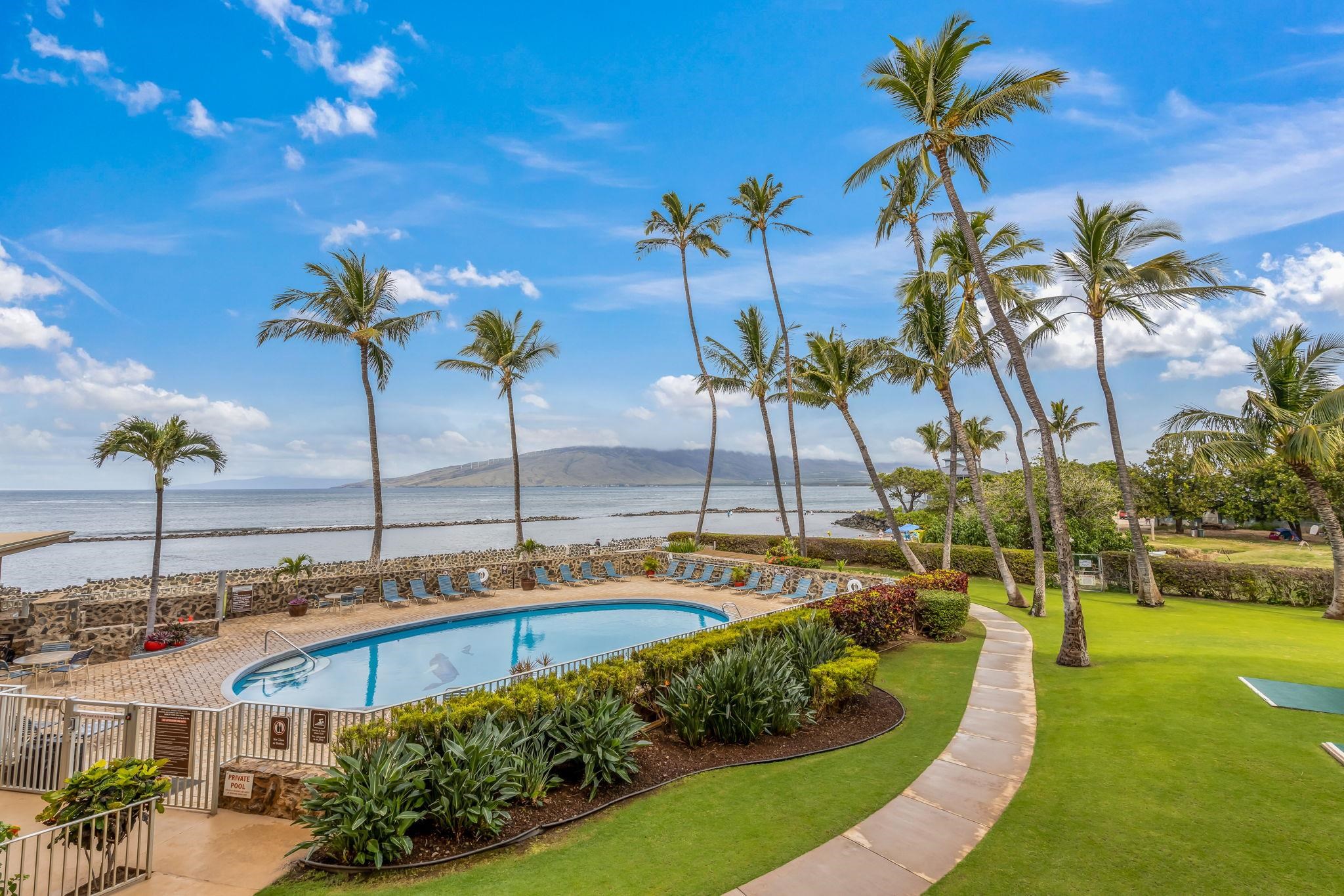 760 South Kihei Road, Unit 522 Kihei, HI 96753 - Photo 4 of 48 a view of a swimming pool with a table and chairs