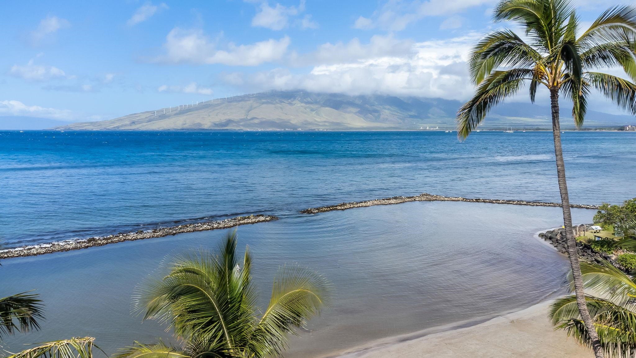760 South Kihei Road, Unit 522 Kihei, HI 96753 - Photo 45 of 48 a view of a swimming pool with a table and chairs