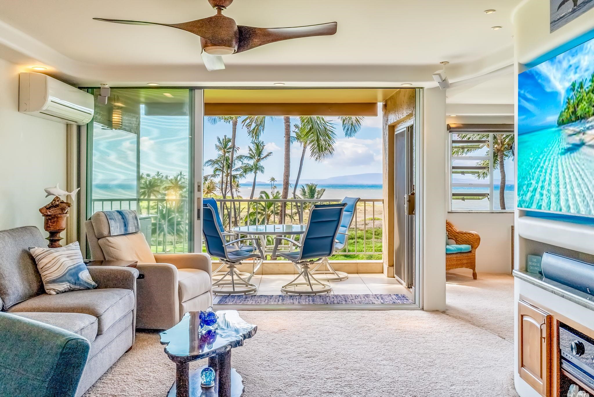 760 South Kihei Road, Unit 522 Kihei, HI 96753 - Photo 7 of 48 a living room with furniture and floor to ceiling windows