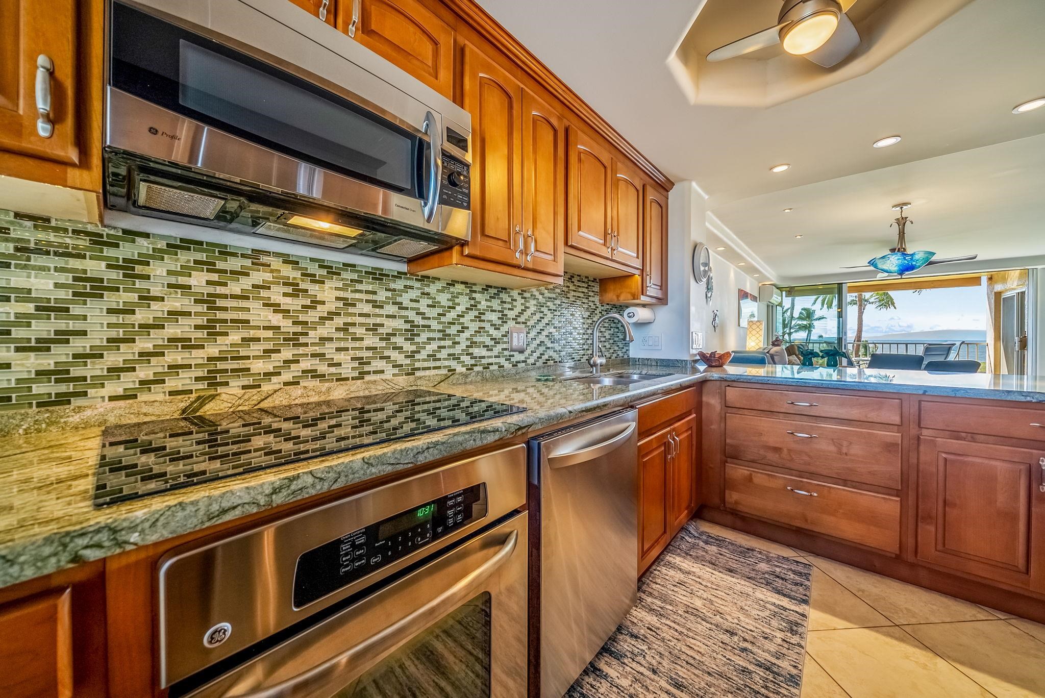 760 South Kihei Road, Unit 522 Kihei, HI 96753 - Photo 8 of 48 a kitchen with stainless steel appliances granite countertop a stove and a sink