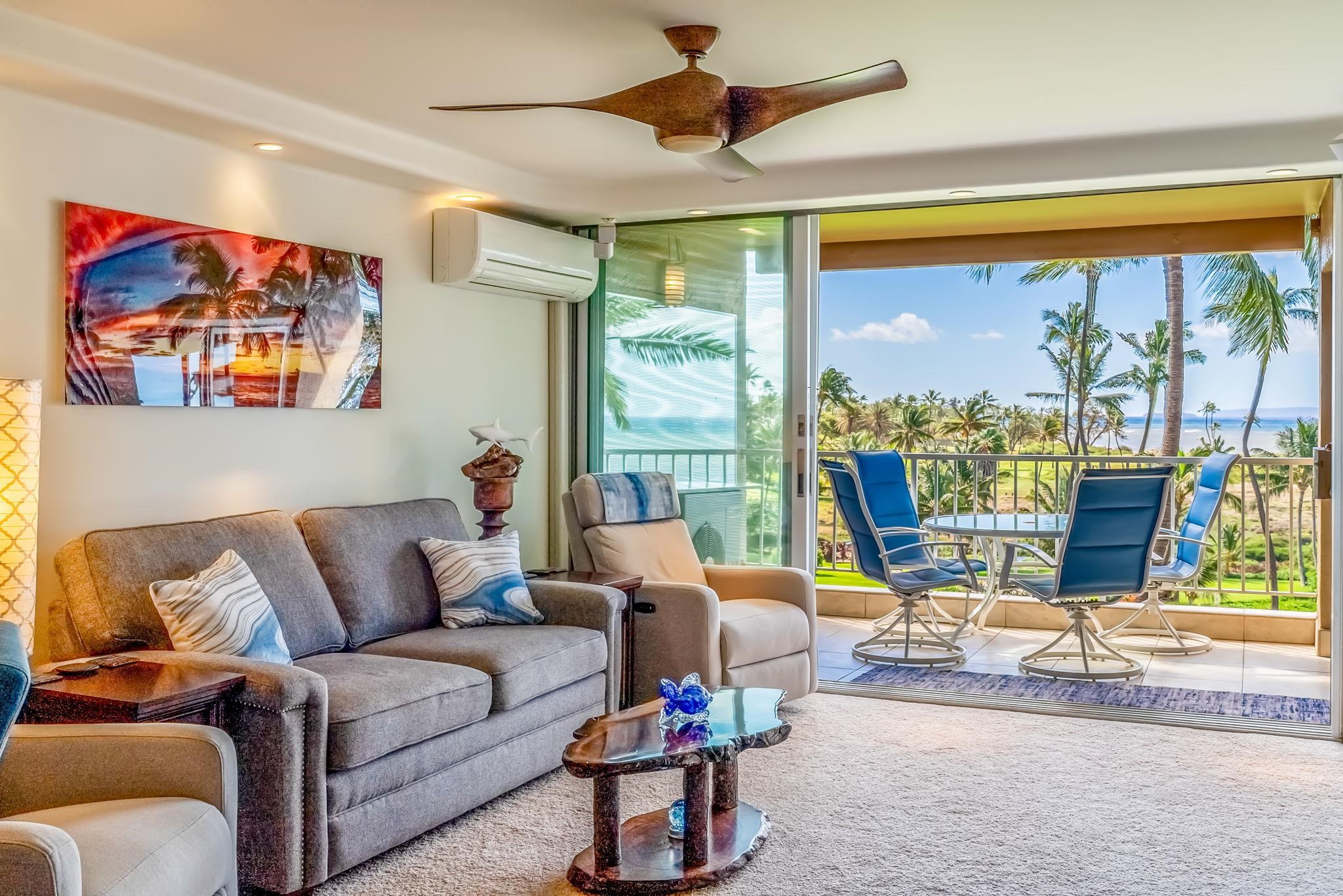 760 South Kihei Road, Unit 522 Kihei, HI 96753 - Photo 9 of 48 a living room with furniture and a large window