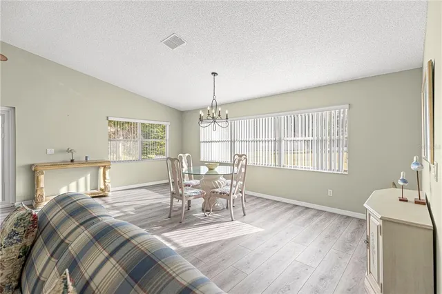 a view of a livingroom with furniture and chandelier