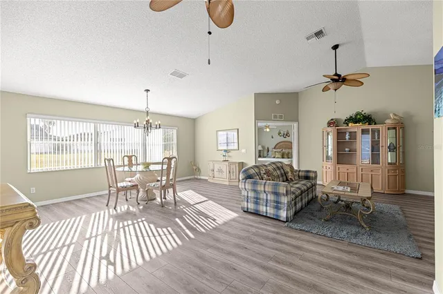 a kitchen with appliances a sink and cabinets