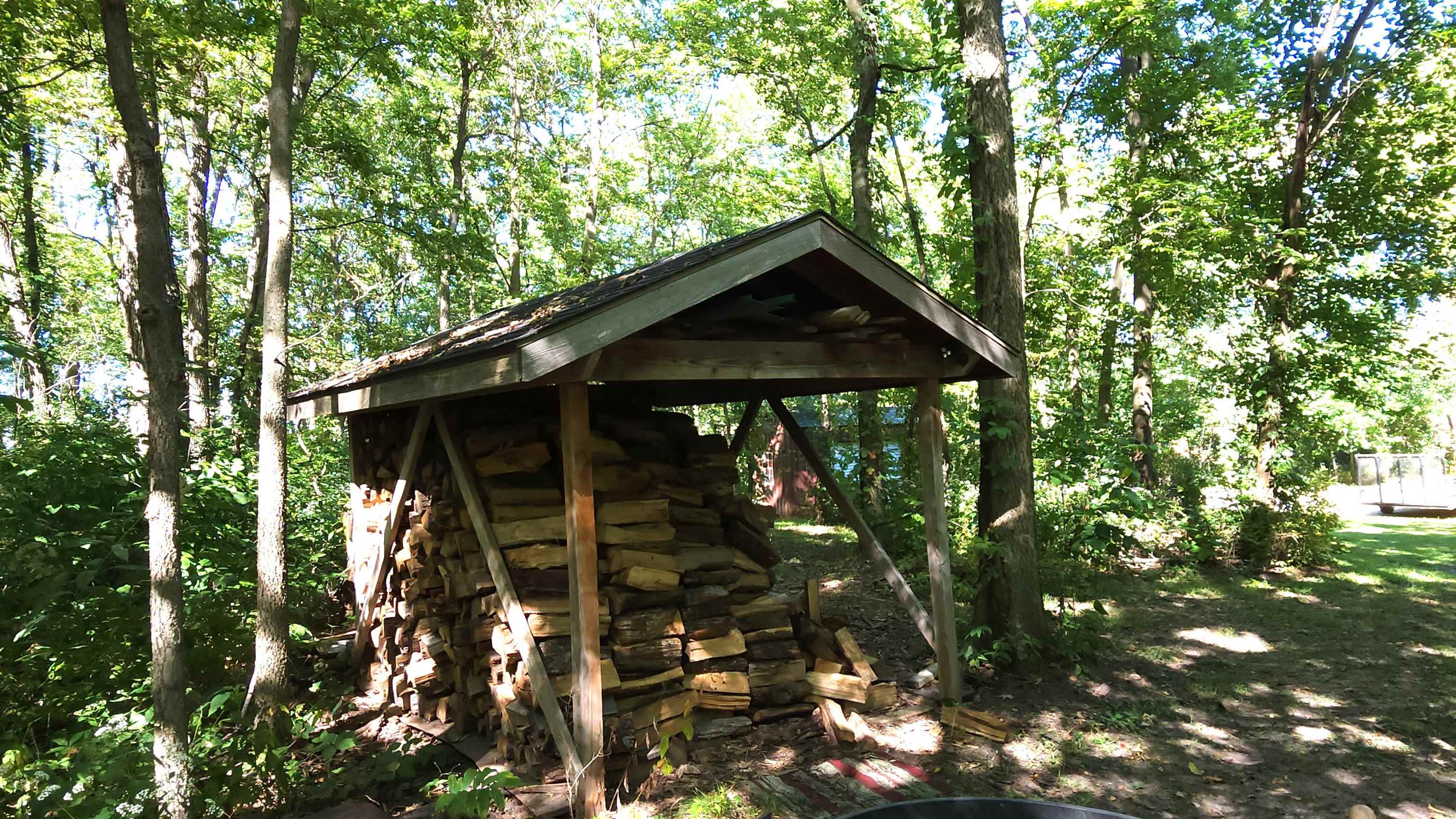 6262 North Eggert Road Rock City, IL 61070 - Photo 13 of 75 a small barn in the middle of a tree