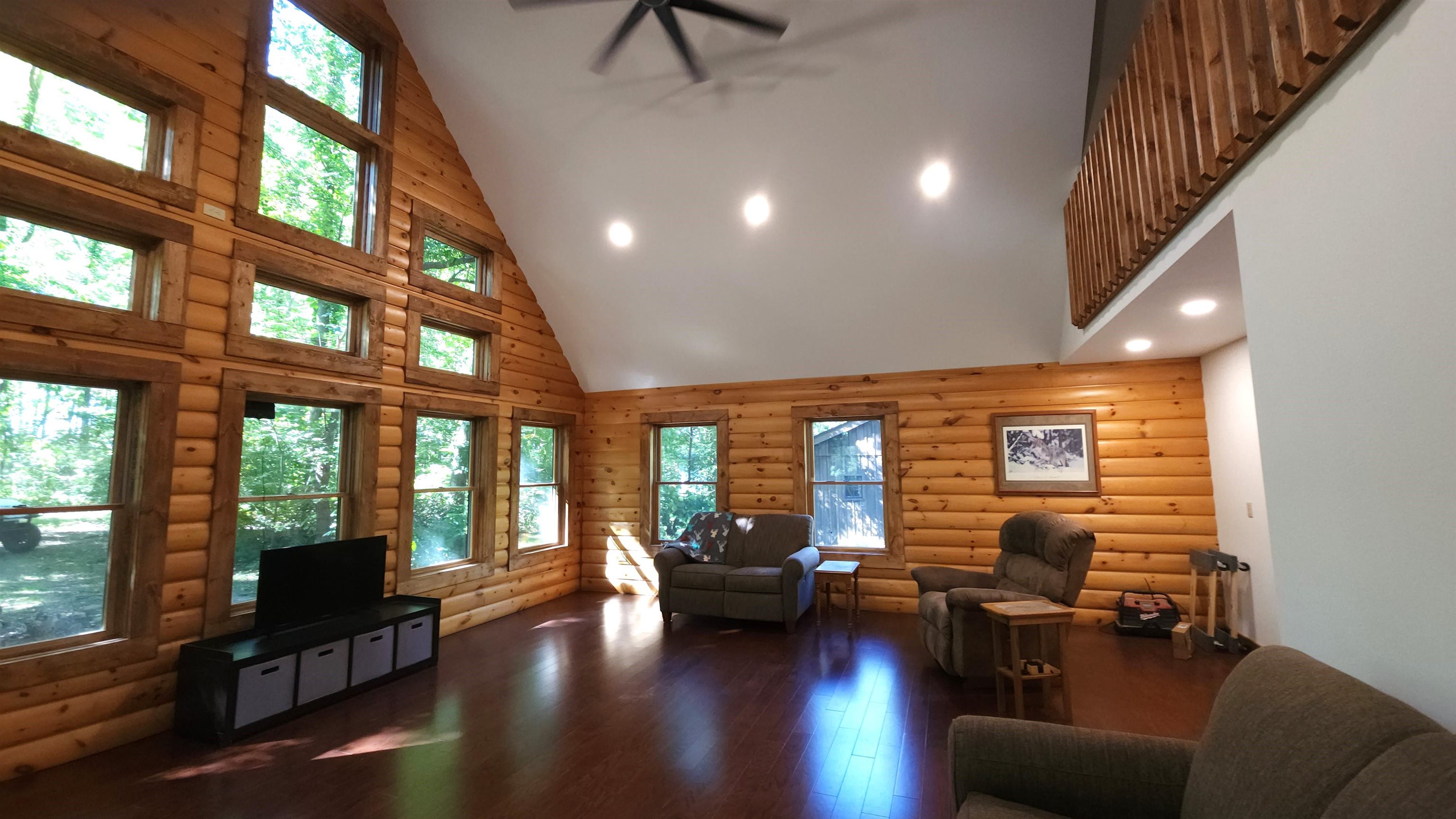 6262 North Eggert Road Rock City, IL 61070 - Photo 20 of 75 a living room with furniture floor to ceiling window and wooden floor
