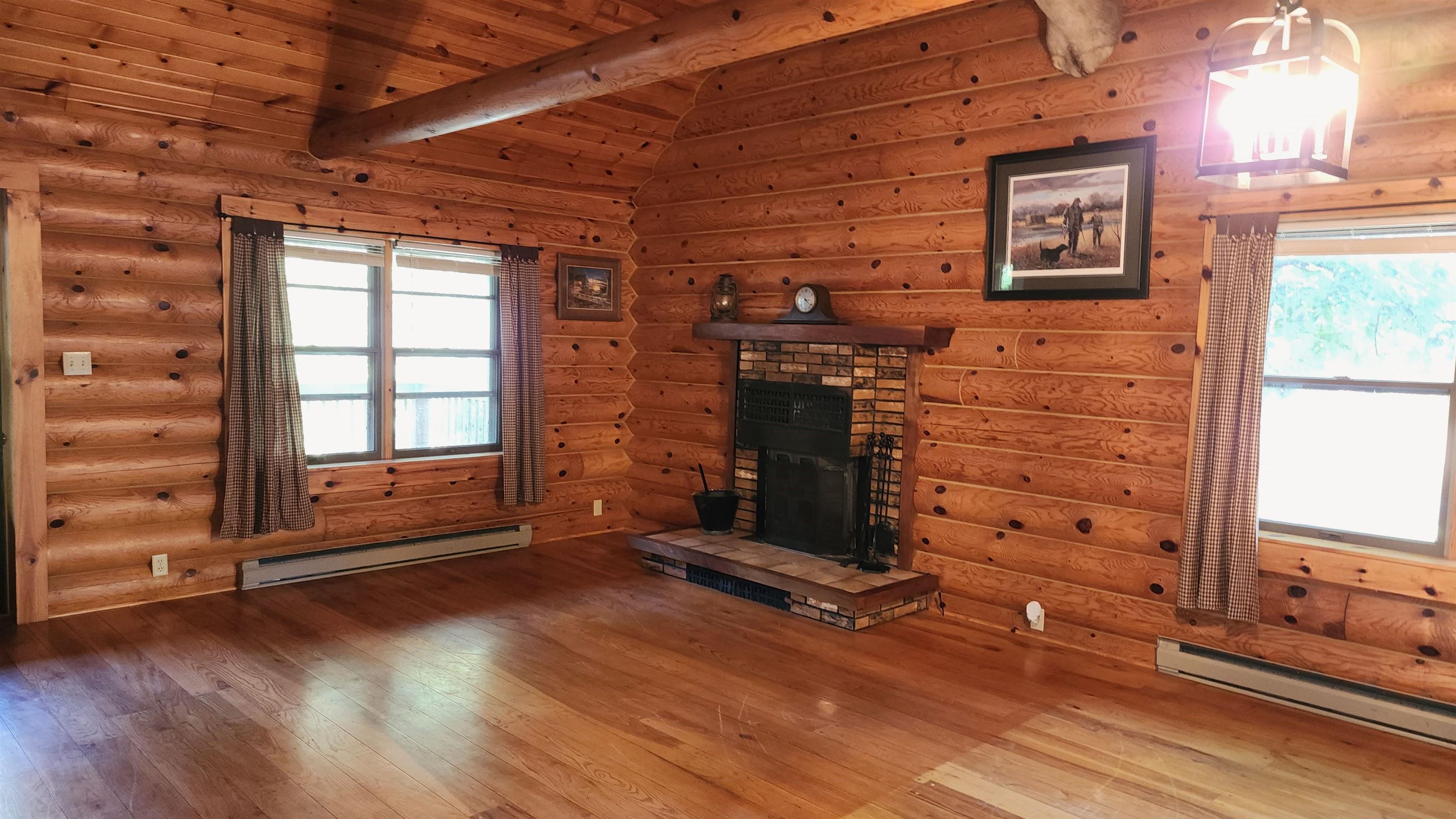 6262 North Eggert Road Rock City, IL 61070 - Photo 24 of 75 a view of an empty room with wooden floor and a window