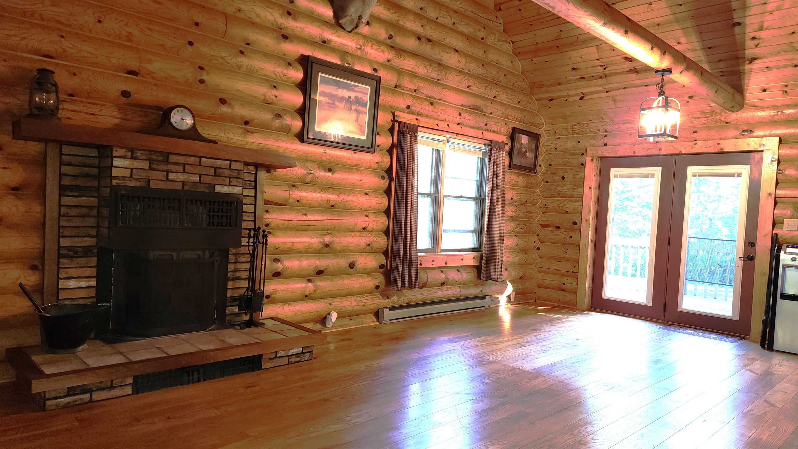 6262 North Eggert Road Rock City, IL 61070 - Photo 28 of 75 an empty room with wooden floor and windows
