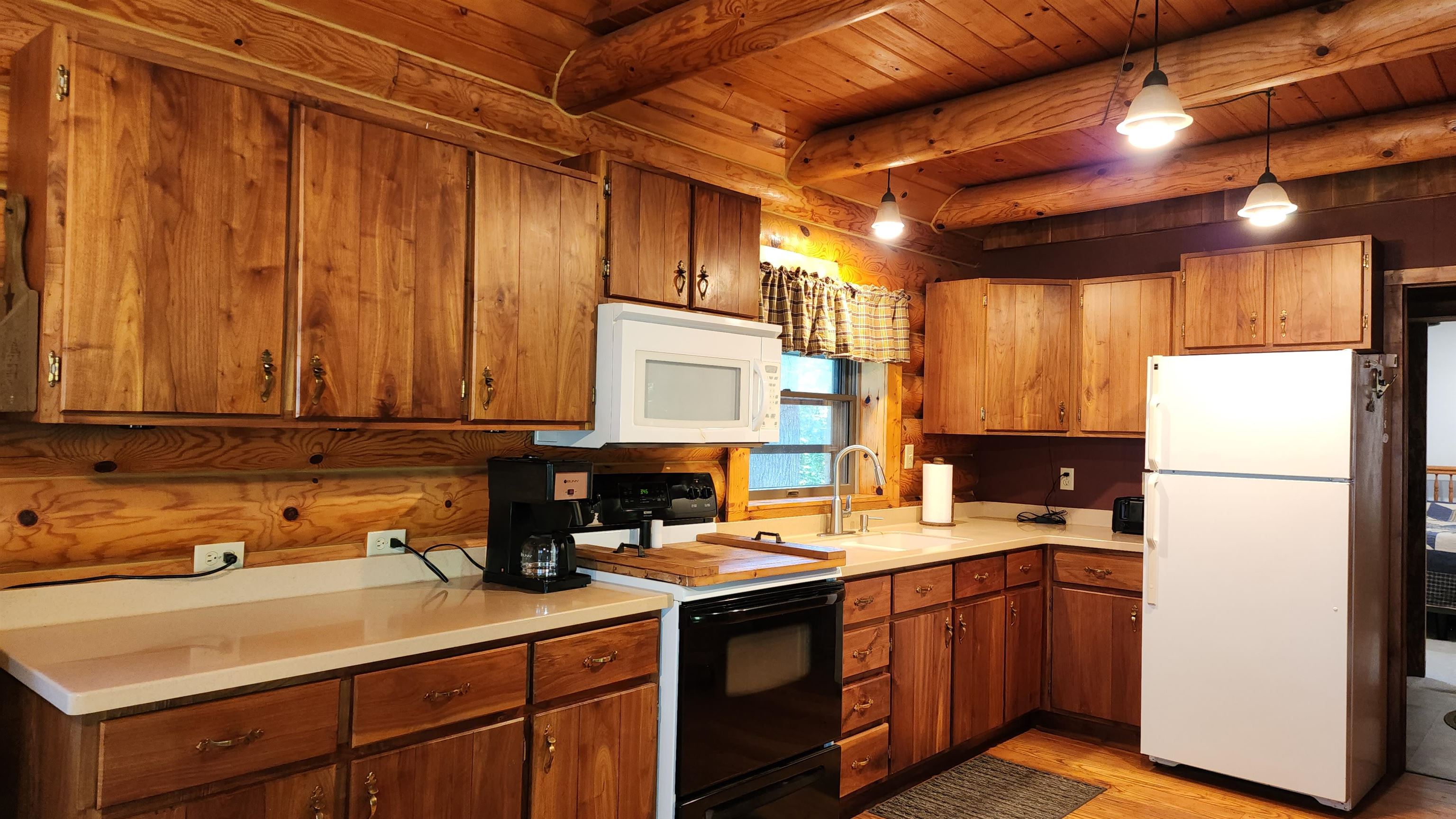 6262 North Eggert Road Rock City, IL 61070 - Photo 33 of 75 a kitchen with refrigerator and cabinets