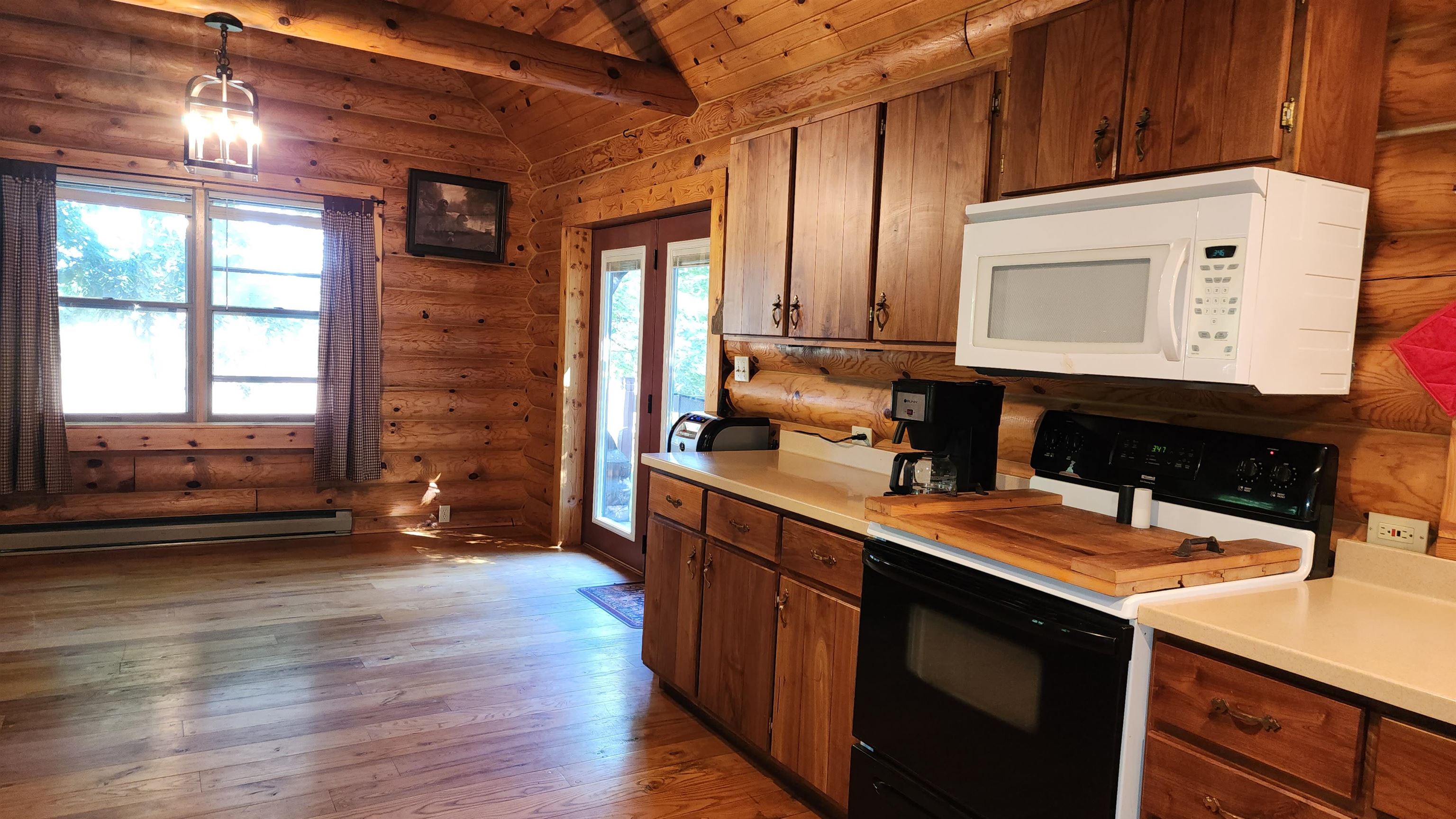 6262 North Eggert Road Rock City, IL 61070 - Photo 34 of 75 a kitchen with a sink stove and cabinets
