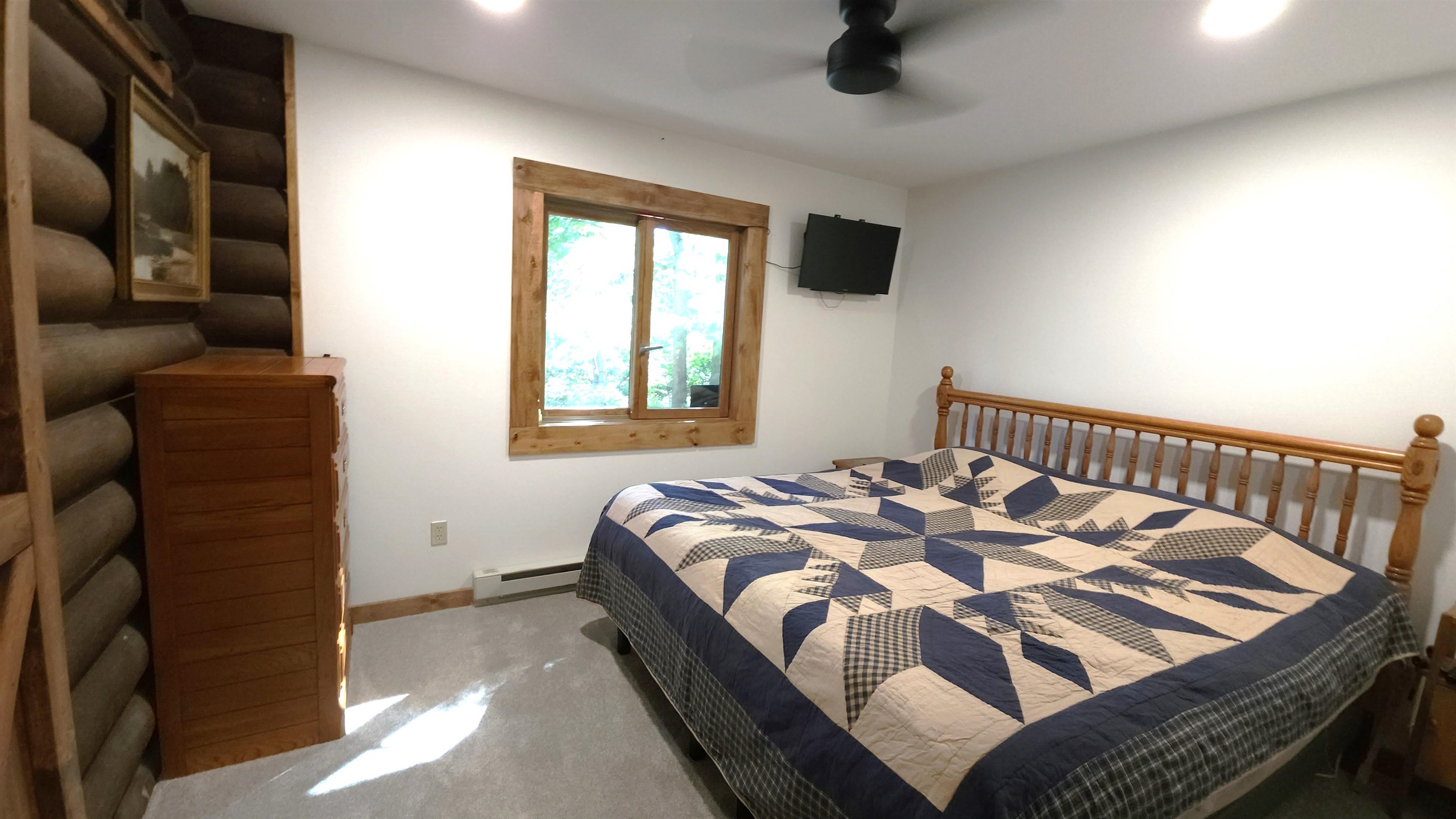 6262 North Eggert Road Rock City, IL 61070 - Photo 41 of 75 a bed sitting in a bedroom next to a window