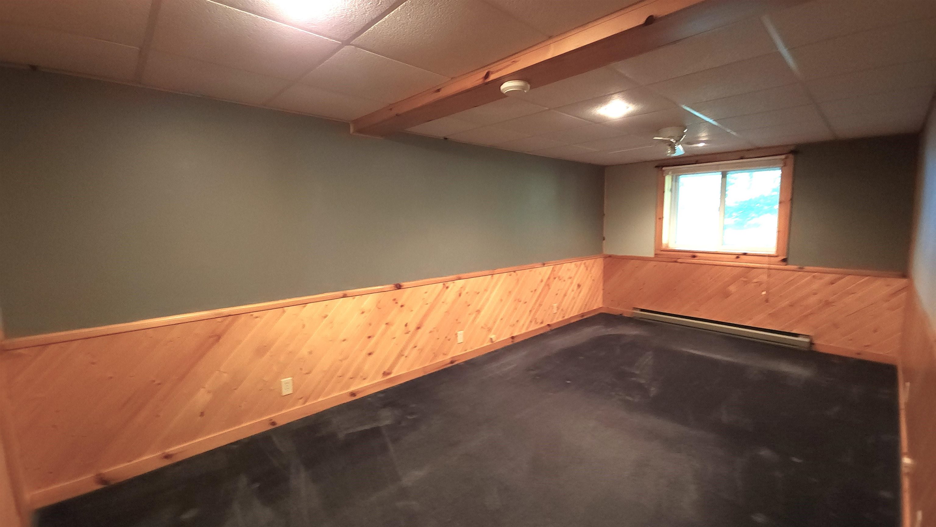 6262 North Eggert Road Rock City, IL 61070 - Photo 57 of 75 an empty room with wooden floor and windows