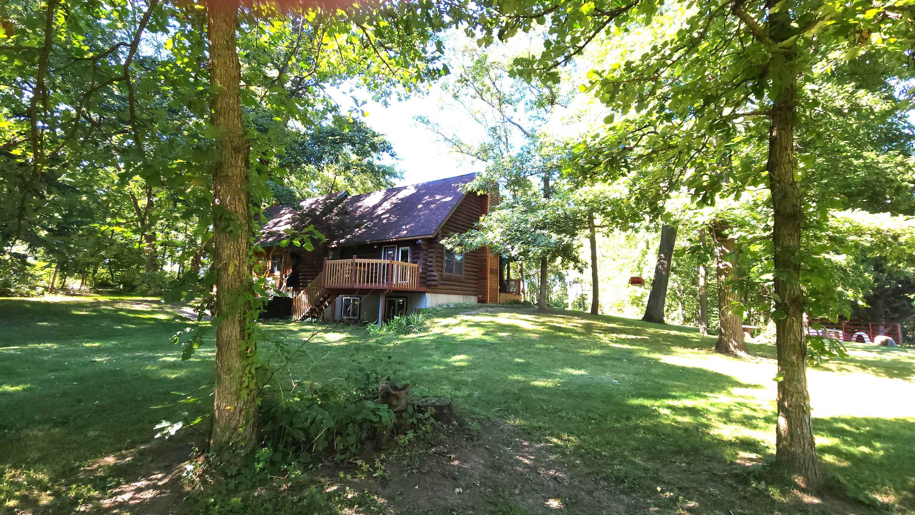 6262 North Eggert Road Rock City, IL 61070 - Photo 73 of 75 a view of a big yard with plants and large trees