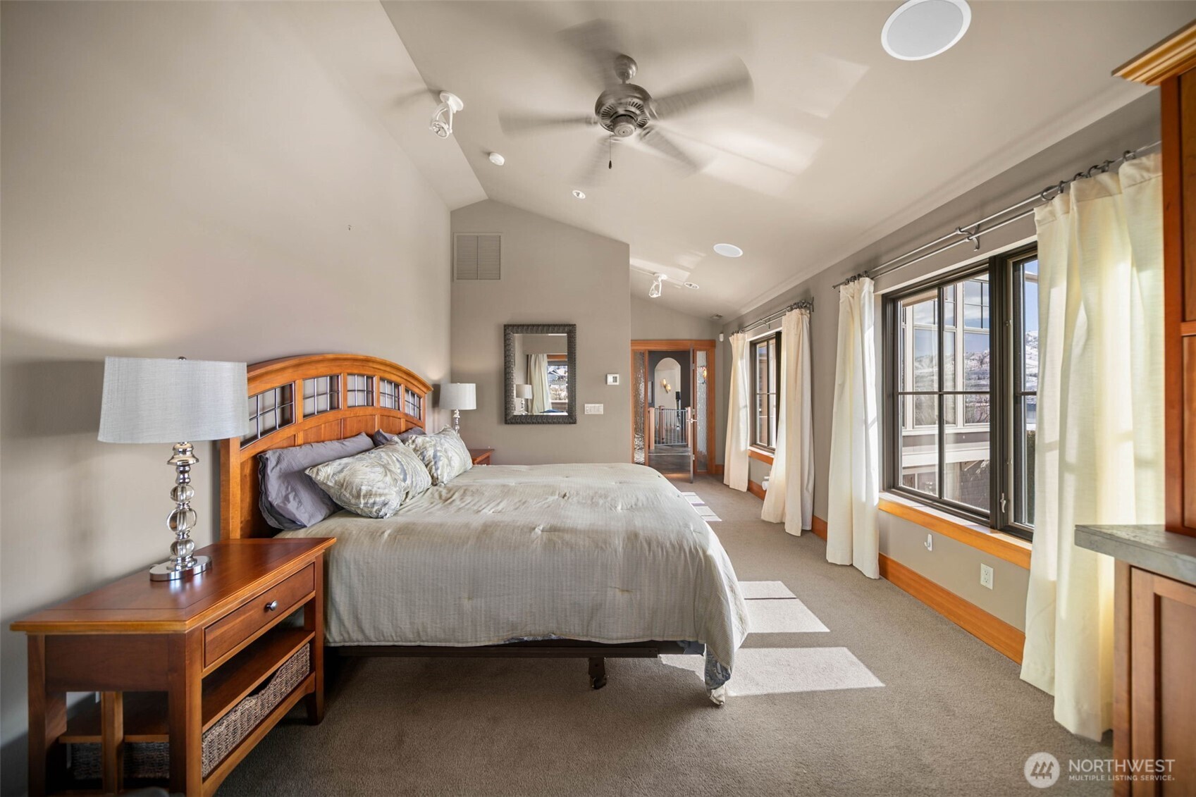 232 Crystal Drive Chelan, WA 98816 - Photo 13 of 39 a bedroom with a bed next to a large window