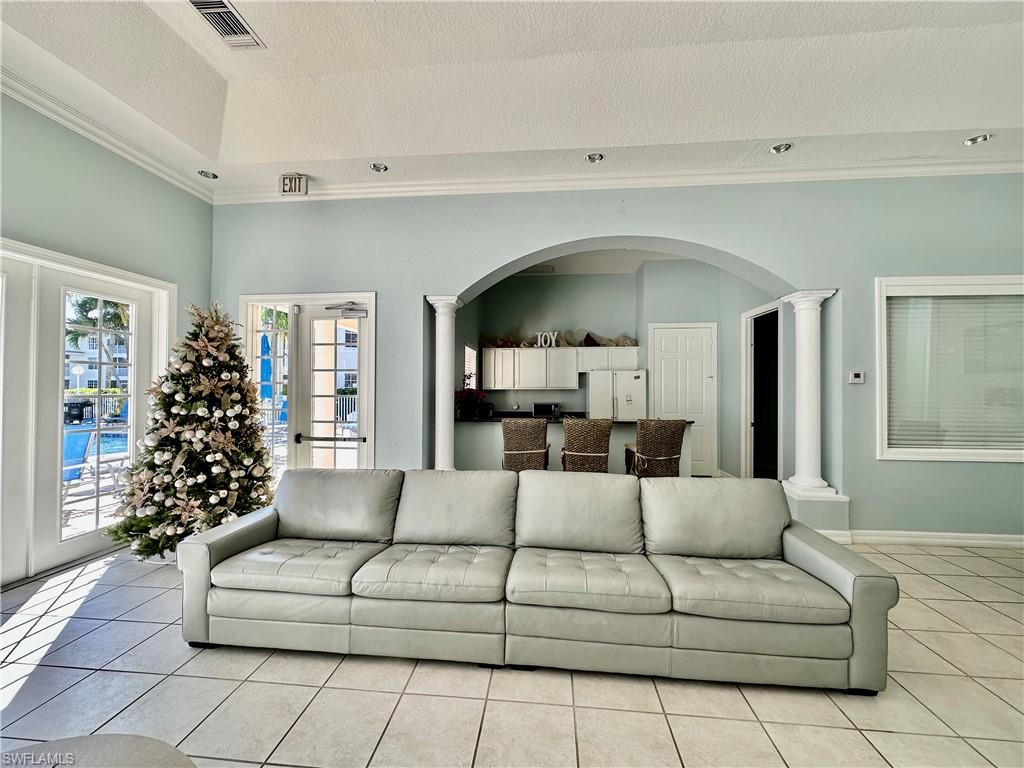 4700 St Croix Lane, Unit 335 Naples, FL 34109 - Photo 30 of 31 a living room with furniture and a large window