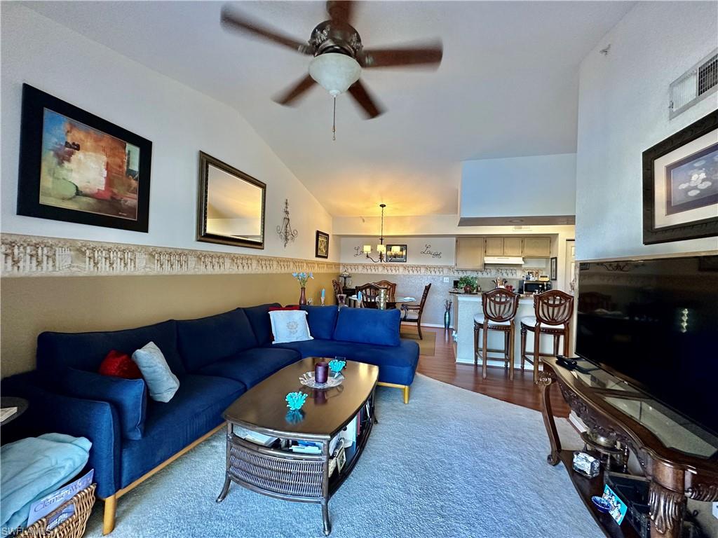 4700 St Croix Lane, Unit 335 Naples, FL 34109 - Photo 3 of 31 a living room with furniture and a flat screen tv