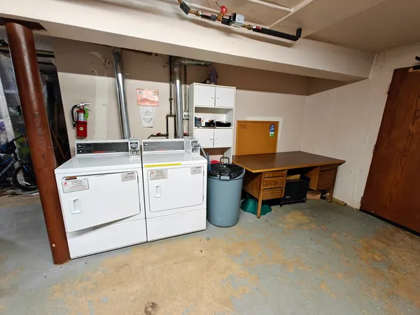 a view of a storage & utility room with washer and dryer