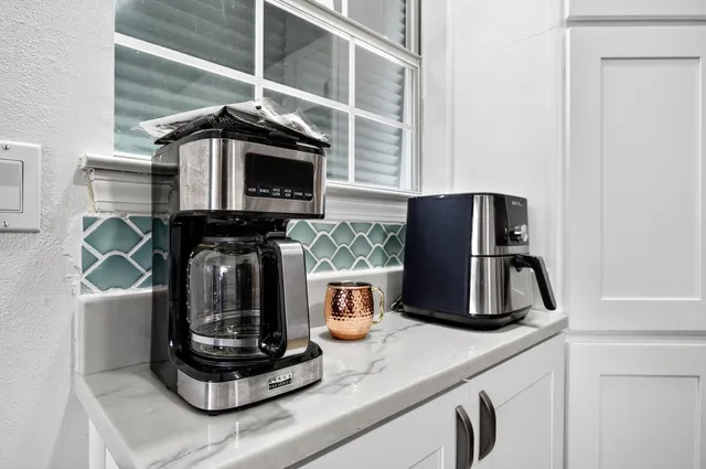 a kitchen with a stove and a microwave