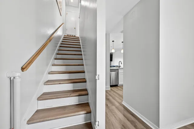 a bedroom with a large bed and a tv