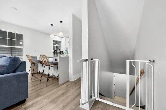 a front view of a building with a garden