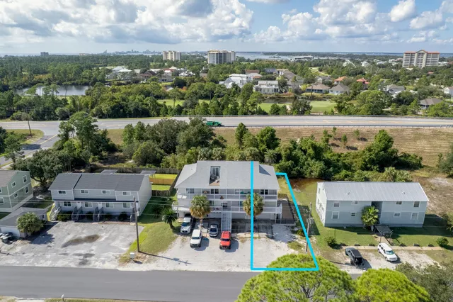 an aerial view of a house with a lake view